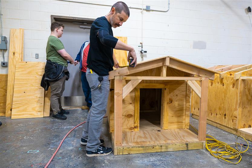 Students build doghouses